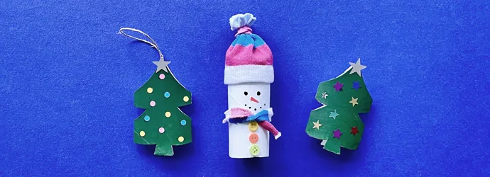 Mother and toddler daughter using toilet roll to make crafts